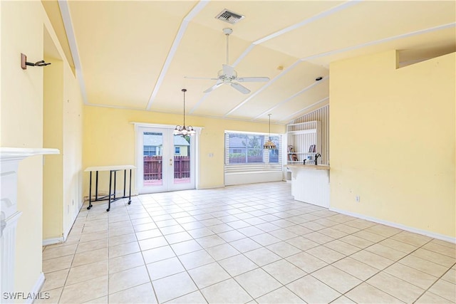 9091 Cypress Dr N, Fort Myers, FL 33967 - unfurnished living room featuring lofted ceiling, a ceiling fan, light tile patterned floors, baseboards, and french doors