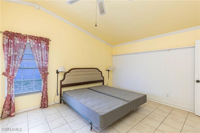 9091 Cypress Dr N, Fort Myers, FL 33967 - tiled bedroom with vaulted ceiling, crown molding, a ceiling fan, and baseboards