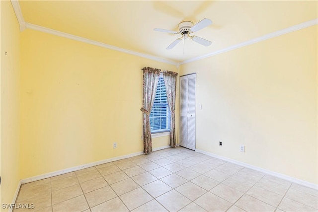 9091 Cypress Dr N, Fort Myers, FL 33967 - unfurnished room with ornamental molding, a ceiling fan, light tile patterned floors, and baseboards