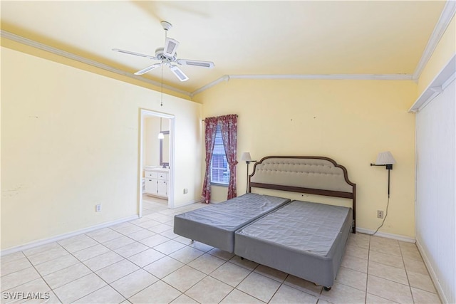 9091 Cypress Dr N, Fort Myers, FL 33967 - bedroom featuring ornamental molding, light tile patterned floors, baseboards, a ceiling fan, and ensuite bath