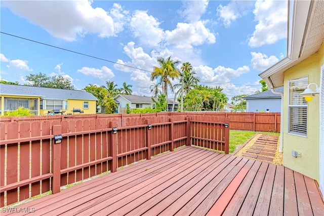 9091 Cypress Dr N, Fort Myers, FL 33967 - wooden deck with a fenced backyard and a residential view