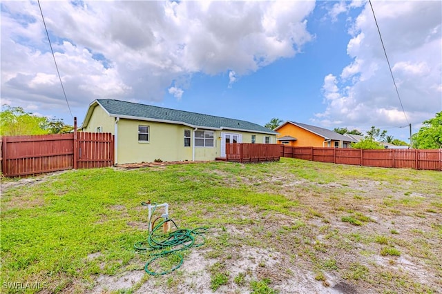 9091 Cypress Dr N, Fort Myers, FL 33967 - rear view of property with stucco siding