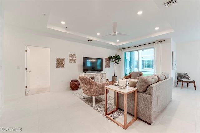 26401 Coco Cay Cir Unit 101, Bonita Springs, FL 34135 - living area with a tray ceiling, a ceiling fan, recessed lighting, and baseboards