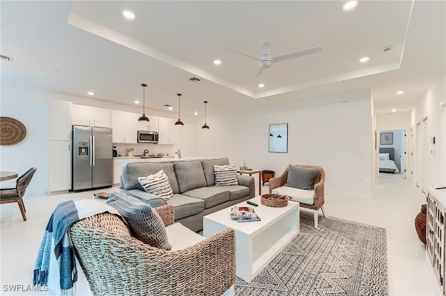 26401 Coco Cay Cir Unit 101, Bonita Springs, FL 34135 - living area with a tray ceiling, recessed lighting, a ceiling fan, and light tile patterned flooring