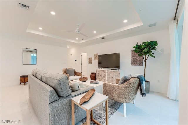 26401 Coco Cay Cir Unit 101, Bonita Springs, FL 34135 - living room with a tray ceiling, recessed lighting, ceiling fan, and light tile patterned floors