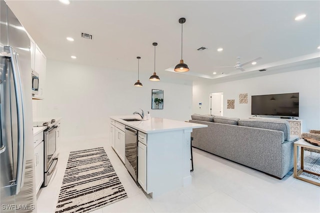 26401 Coco Cay Cir Unit 101, Bonita Springs, FL 34135 - kitchen with appliances with stainless steel finishes, recessed lighting, a sink, light countertops, and white cabinetry