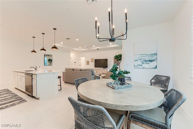 26401 Coco Cay Cir Unit 101, Bonita Springs, FL 34135 - dining room with a chandelier, a raised ceiling, light tile patterned floors, and recessed lighting