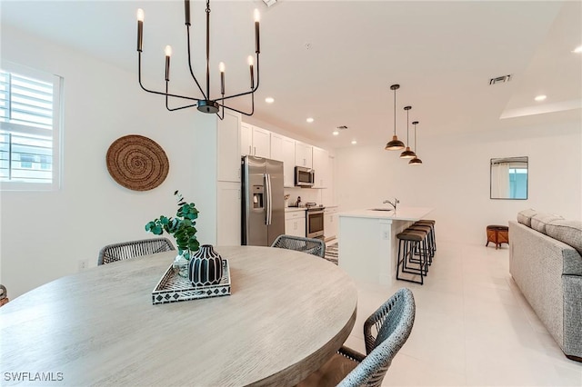 26401 Coco Cay Cir Unit 101, Bonita Springs, FL 34135 - dining area featuring plenty of natural light, recessed lighting, a chandelier, and light tile patterned floors
