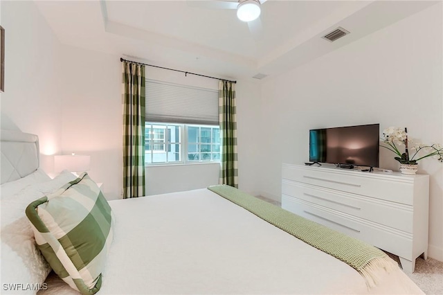 26401 Coco Cay Cir Unit 101, Bonita Springs, FL 34135 - bedroom with carpet floors, ceiling fan, and a tray ceiling