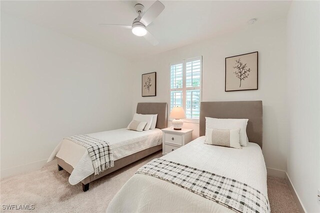 26401 Coco Cay Cir Unit 101, Bonita Springs, FL 34135 - bedroom featuring light colored carpet, baseboards, and a ceiling fan