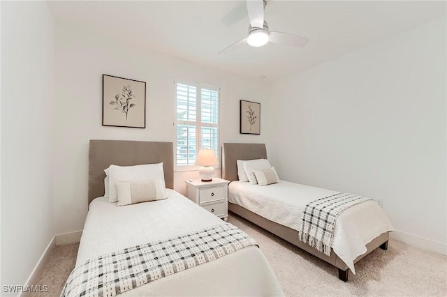 26401 Coco Cay Cir Unit 101, Bonita Springs, FL 34135 - bedroom with baseboards, light colored carpet, and ceiling fan