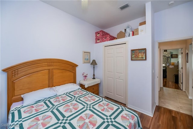 1115 Comet Ave, Labelle, FL 33935 - bedroom with a closet, wood finished floors, baseboards, and ceiling fan