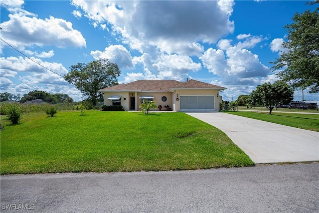 1115 Comet Ave, Labelle, FL 33935 - single story home featuring concrete driveway, an attached garage, a front yard, and stucco siding