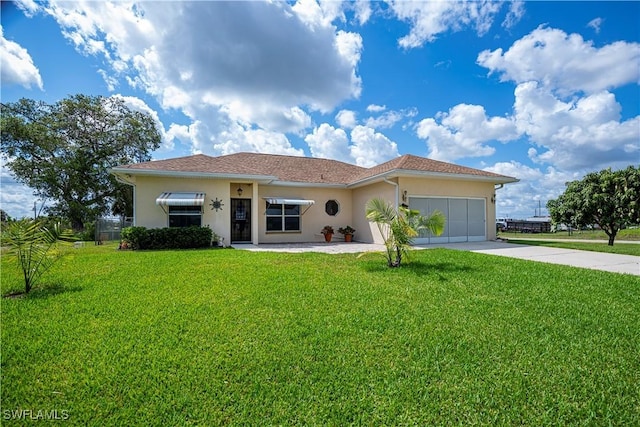 1115 Comet Ave, Labelle, FL 33935 - ranch-style home featuring stucco siding, a front lawn, concrete driveway, and an attached garage