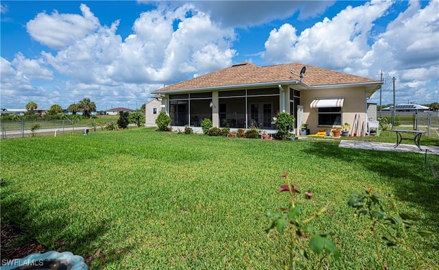 1115 Comet Ave, Labelle, FL 33935 - rear view of house with a sunroom and stucco siding