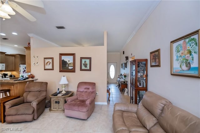 1115 Comet Ave, Labelle, FL 33935 - living area with ornamental molding, light tile patterned floors, a ceiling fan, vaulted ceiling, and baseboards