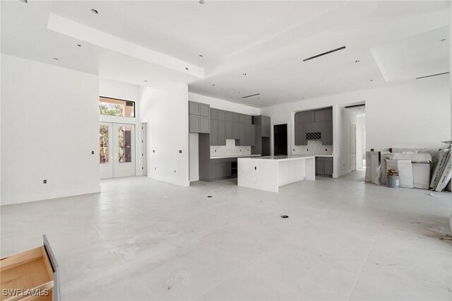 721 Golden Gate Blvd W, Naples, FL 34120 - unfurnished living room featuring french doors and a high ceiling