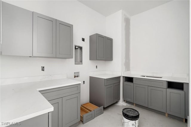 721 Golden Gate Blvd W, Naples, FL 34120 - laundry area featuring washer hookup and cabinet space