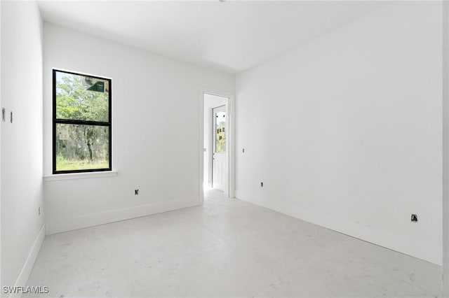 721 Golden Gate Blvd W, Naples, FL 34120 - unfurnished room featuring baseboards and finished concrete flooring