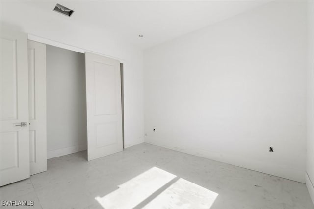 721 Golden Gate Blvd W, Naples, FL 34120 - unfurnished bedroom with a closet