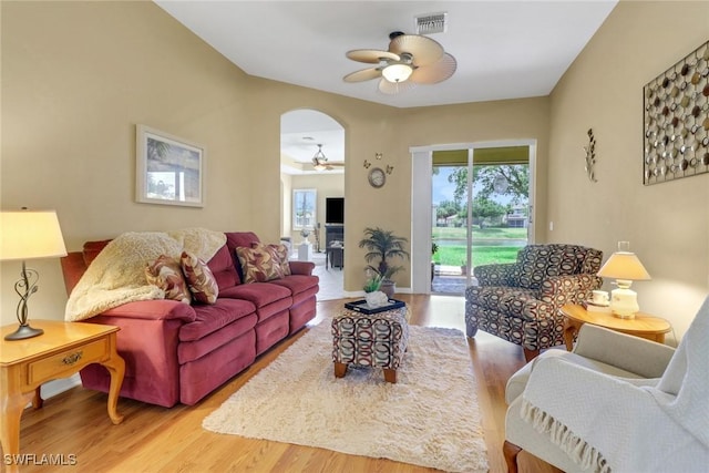 3032 Lake Manatee Ct, Cape Coral, FL 33909 - living area featuring a ceiling fan, wood finished floors, and arched walkways