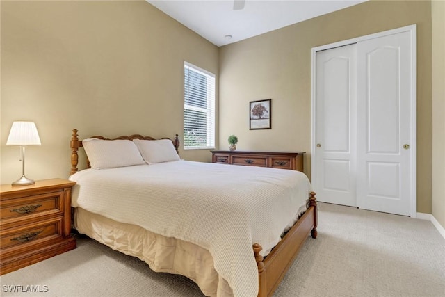 3032 Lake Manatee Ct, Cape Coral, FL 33909 - bedroom featuring a closet, light carpet, a ceiling fan, and baseboards