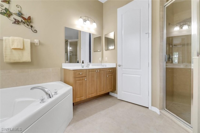 3032 Lake Manatee Ct, Cape Coral, FL 33909 - bathroom featuring vanity, a stall shower, a bath, and tile patterned flooring