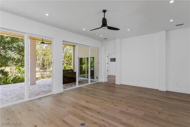 2854 Coach House Way, Naples, FL 34105 - empty room with wood finished floors, recessed lighting, a ceiling fan, and baseboards