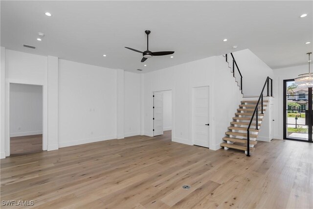 2854 Coach House Way, Naples, FL 34105 - unfurnished living room with stairway, a ceiling fan, recessed lighting, light wood finished floors, and baseboards