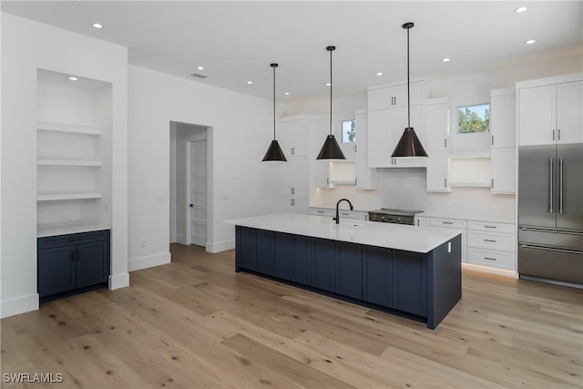2854 Coach House Way, Naples, FL 34105 - kitchen with high quality fridge, open shelves, white cabinetry, light wood-style floors, and recessed lighting