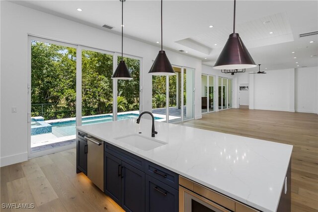 2854 Coach House Way, Naples, FL 34105 - kitchen featuring a sink, dishwasher, light wood-style floors, open floor plan, and recessed lighting