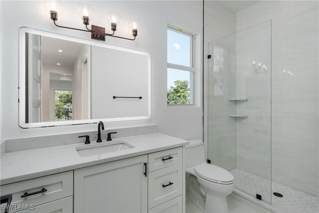 2854 Coach House Way, Naples, FL 34105 - full bathroom with vanity, toilet, and a tile shower