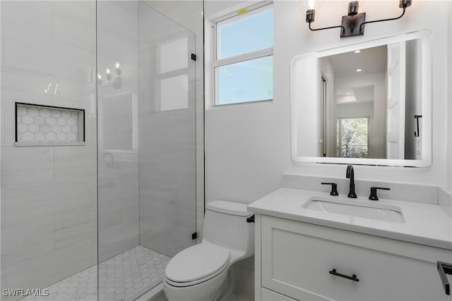 2854 Coach House Way, Naples, FL 34105 - full bathroom featuring toilet, vanity, plenty of natural light, and a tile shower