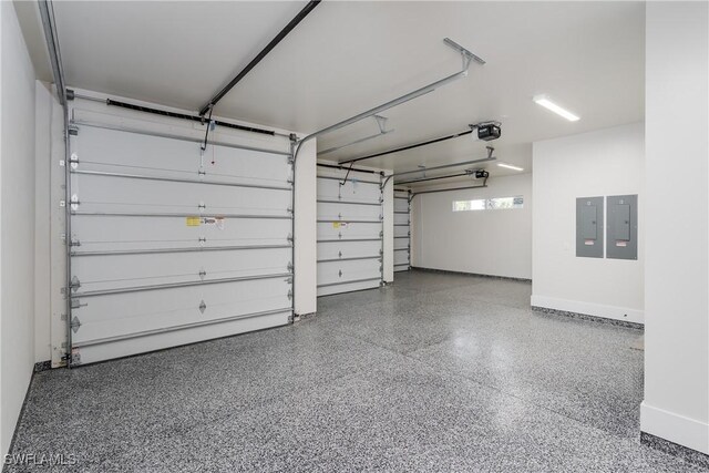 2854 Coach House Way, Naples, FL 34105 - garage with electric panel, a garage door opener, and baseboards