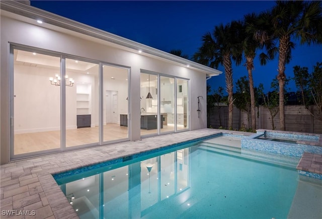 2854 Coach House Way, Naples, FL 34105 - pool at twilight featuring a patio area and a pool with connected hot tub