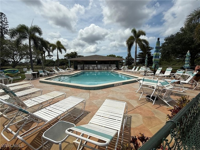 5499 Rattlesnake Hammock Rd Unit A 103, Naples, FL 34113 - community pool with a patio