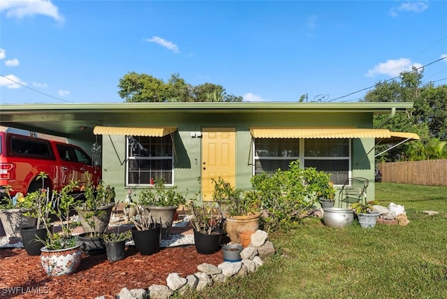 1154 4th Way N, Fort Myers, FL 33903 - view of front facade with a carport