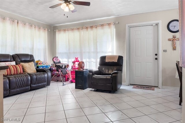 1154 4th Way N, Fort Myers, FL 33903 - living area with ceiling fan and light tile patterned flooring