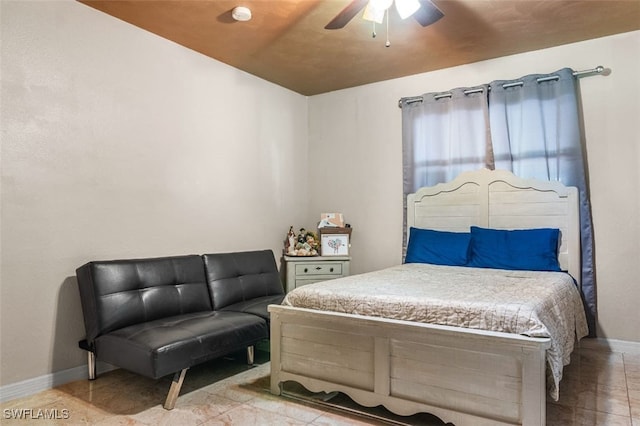 1154 4th Way N, Fort Myers, FL 33903 - tiled bedroom featuring baseboards and a ceiling fan