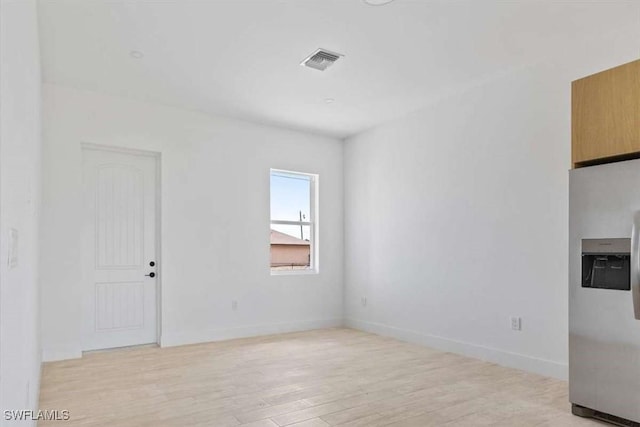 2902 61st St W, Lehigh Acres, FL 33971 - spare room featuring light wood finished floors and baseboards