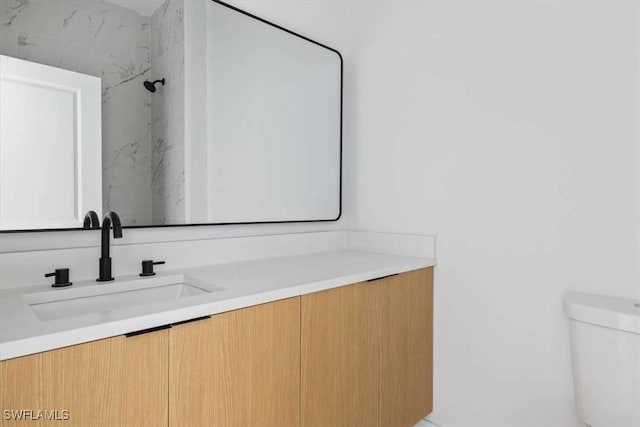 2902 61st St W, Lehigh Acres, FL 33971 - bathroom featuring vanity, toilet, and a marble finish shower