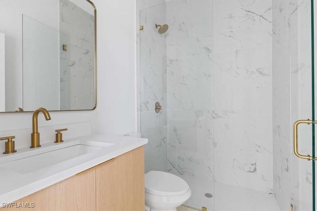 2902 61st St W, Lehigh Acres, FL 33971 - bathroom featuring a marble finish shower, toilet, and vanity