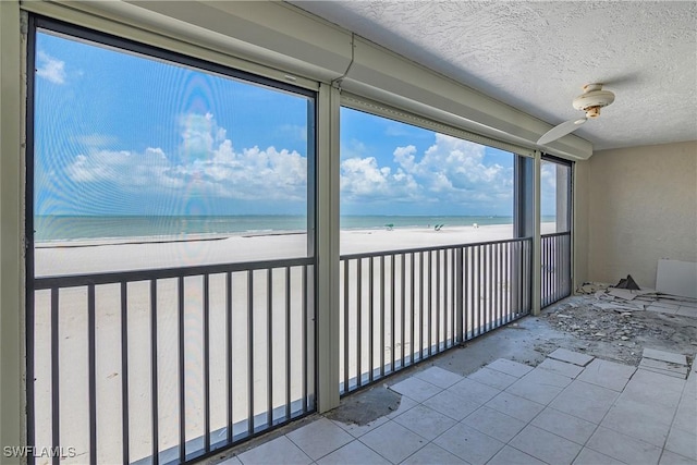 538 Estero Blvd Unit 102, Fort Myers Beach, FL 33931 - unfurnished sunroom featuring view of water and beach