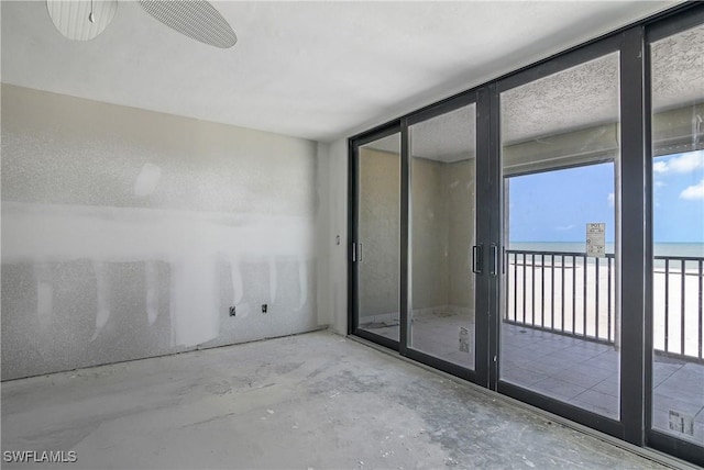 538 Estero Blvd Unit 102, Fort Myers Beach, FL 33931 - spare room with a water view and unfinished concrete flooring