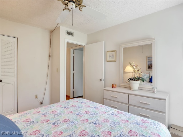 5479 Peppertree Dr Unit 13, Fort Myers, FL 33908 - bedroom with a textured ceiling and ceiling fan