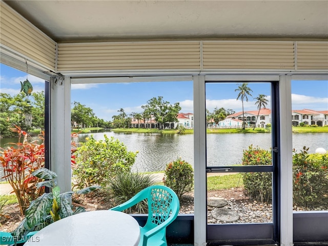 5479 Peppertree Dr Unit 13, Fort Myers, FL 33908 - sunroom with a water view and a residential view