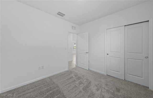 44225 Kelly Dr, Punta Gorda, FL 33982 - unfurnished bedroom with carpet, baseboards, and a closet