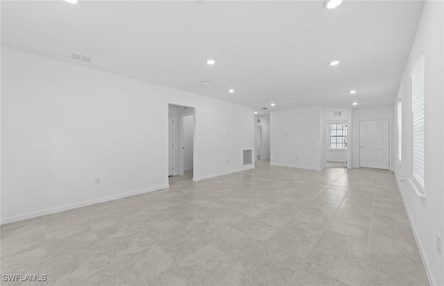 44225 Kelly Dr, Punta Gorda, FL 33982 - unfurnished living room featuring recessed lighting and baseboards