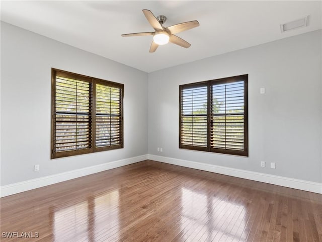 18251 Parkridge Ct, Fort Myers, FL 33908 - unfurnished room with ceiling fan, wood finished floors, and baseboards