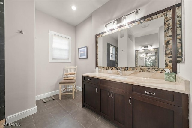 646 Vintage Reserve Cir Unit 4D, Naples, FL 34119 - bathroom with vanity, baseboards, tile patterned flooring, and decorative backsplash